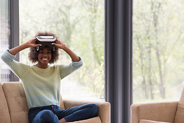 Image showing black woman using VR headset glasses of virtual reality