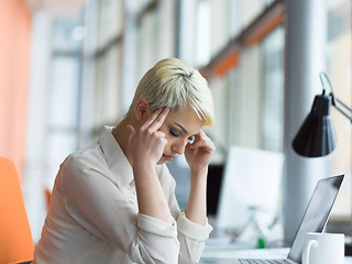 Image showing businesswoman using a laptop in startup office