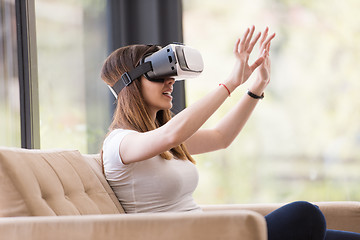 Image showing woman using VR-headset glasses of virtual reality