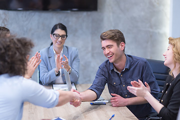 Image showing cloasing the deal in modern office interior