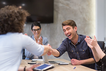 Image showing cloasing the deal in modern office interior