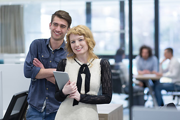 Image showing Business People Working With Tablet in startup office