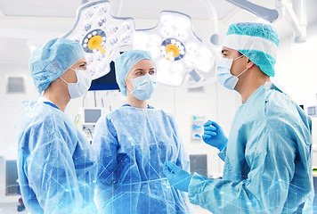 Image showing group of surgeons in operating room at hospital