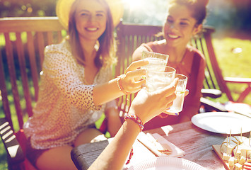 Image showing happy friends with drinks at summer garden party