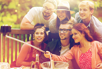 Image showing friends taking selfie at party in summer garden