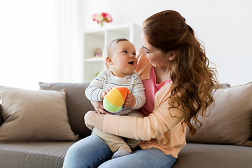 Image showing happy young mother with little baby at home