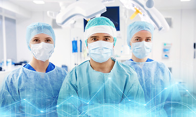 Image showing group of surgeons in operating room at hospital