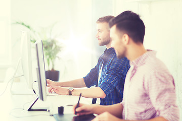 Image showing creative man or student with computer at office