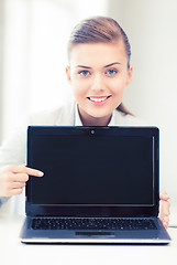 Image showing businesswoman with laptop in office