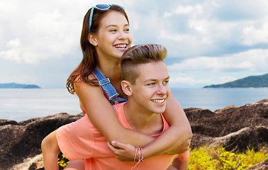 Image showing happy teenage couple having fun outdoors