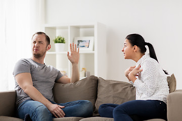 Image showing unhappy couple having argument at home