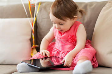 Image showing baby girl with tablet pc at home