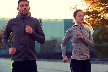 Image showing couple running outdoors