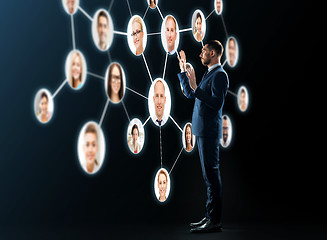 Image showing buisnessman looking at contacts network