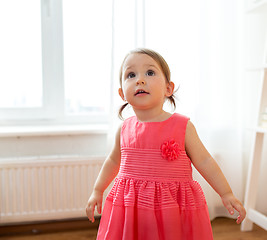 Image showing happy baby girl in dress at home