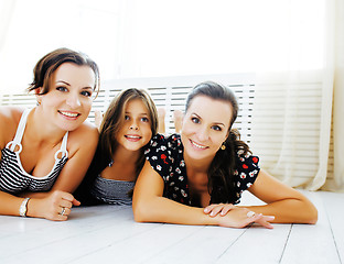 Image showing Mature sisters twins at home with little daughter, happy family 