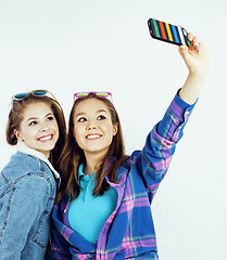 Image showing best friends teenage girls together having fun, posing emotional on white background, besties happy smiling, lifestyle people concept close up