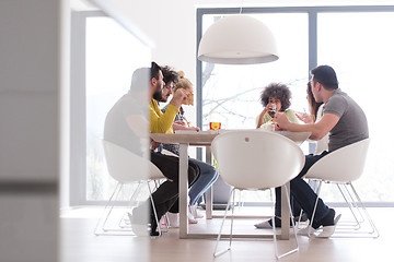 Image showing multiethnic group of happy friends lunch time