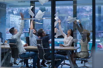 Image showing startup Group of young business people throwing documents