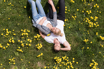 Image showing man and woman lying on the grass