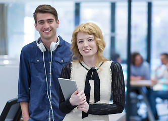 Image showing Business People Working With Tablet in startup office