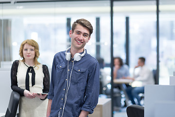 Image showing Business People Working With Tablet in startup office