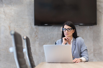 Image showing businesswoman using a laptop in startup office