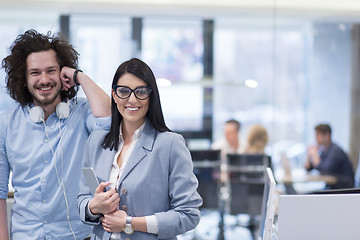 Image showing Business People Working With Tablet in startup office