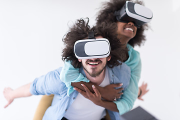 Image showing multiethnic couple getting experience using VR headset glasses