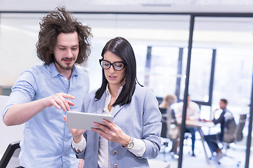 Image showing Business People Working With Tablet in startup office