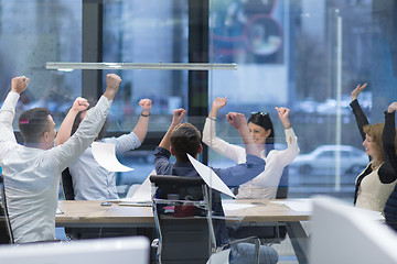 Image showing startup Group of young business people throwing documents