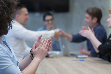 Image showing cloasing the deal in modern office interior