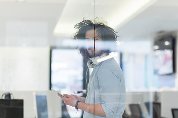 Image showing businessman using tablet computer