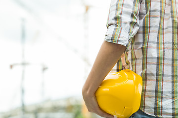 Image showing Photo of builder with helmet