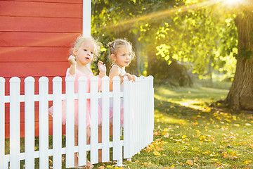 Image showing The two little girls at playground against park or green forest