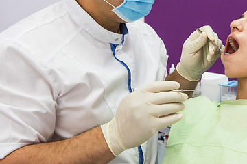 Image showing Dentist working in dentist office