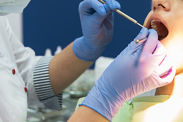 Image showing Dentist working in dentist office