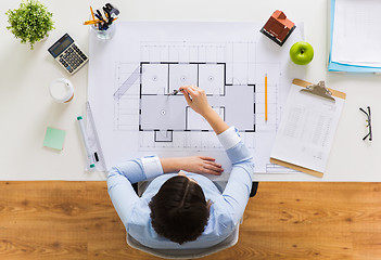 Image showing architect with compass measuring blueprint