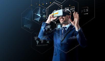 Image showing businessman in virtual reality headset over black
