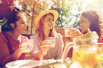 Image showing happy friends having party at summer garden