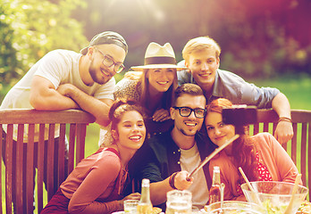 Image showing friends taking selfie at party in summer garden