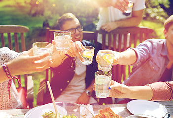 Image showing happy friends with drinks at summer garden party