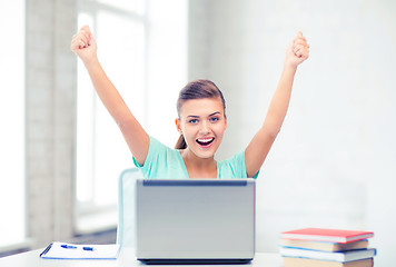 Image showing happy student girl with laptop at school