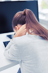 Image showing stressed woman with computer