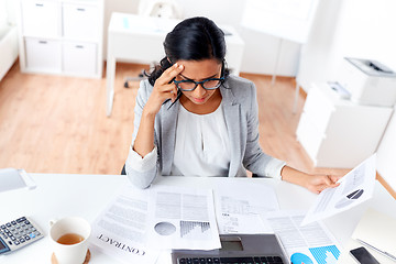 Image showing businesswoman with laptop working at office