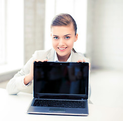 Image showing businesswoman with laptop in office