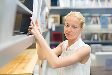 Image showing Woman shopping for furniture, sofa and home decor in store.