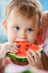 Image showing Child eating watermelon