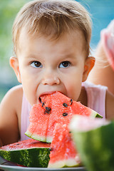 Image showing Child eating watermelon