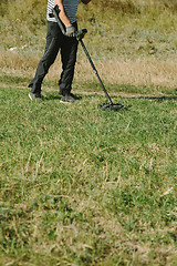 Image showing Person with metal finder on nature